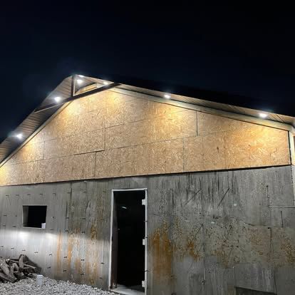 Exterior build at dusk with eave lighting